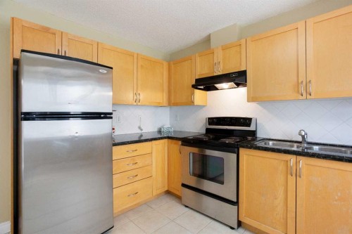 120 Cedarwood Lane Sw, Calgary, AB - Indoor Photo Showing Kitchen With Stainless Steel Kitchen