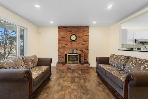 95 Silver Brook Drive Nw, Calgary, AB - Indoor Photo Showing Living Room With Fireplace