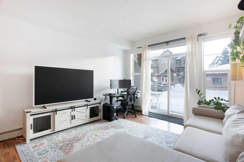 1116-211 Aspen Stone Boulevard Sw, Calgary, AB - Indoor Photo Showing Living Room