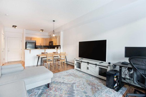 1116-211 Aspen Stone Boulevard Sw, Calgary, AB - Indoor Photo Showing Living Room