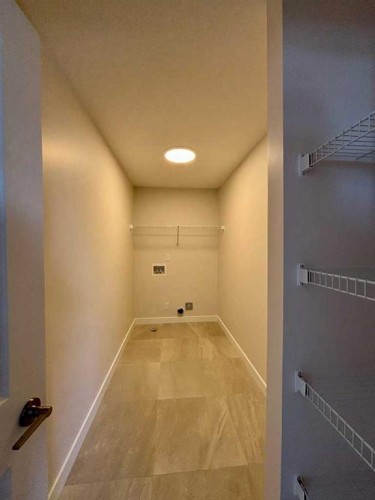 695 Buffaloberry Manor Se, Calgary, AB - Indoor Photo Showing Other Room