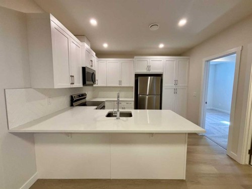 695 Buffaloberry Manor Se, Calgary, AB - Indoor Photo Showing Kitchen