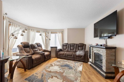 131 Cambria Road, Strathmore, AB - Indoor Photo Showing Living Room With Fireplace