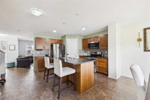121 River Heights Crescent, Cochrane, AB - Indoor Photo Showing Kitchen With Double Sink