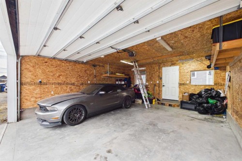 121 River Heights Crescent, Cochrane, AB - Indoor Photo Showing Garage