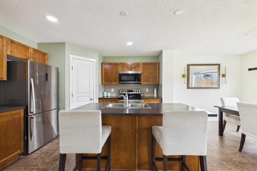 121 River Heights Crescent, Cochrane, AB - Indoor Photo Showing Kitchen With Double Sink