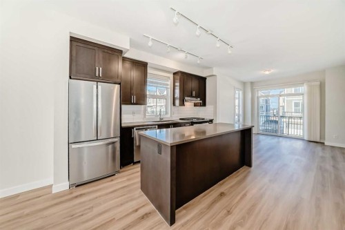 986 Sherwood Boulevard Nw, Calgary, AB - Indoor Photo Showing Kitchen With Stainless Steel Kitchen With Double Sink