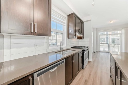 986 Sherwood Boulevard Nw, Calgary, AB - Indoor Photo Showing Kitchen With Stainless Steel Kitchen With Double Sink With Upgraded Kitchen