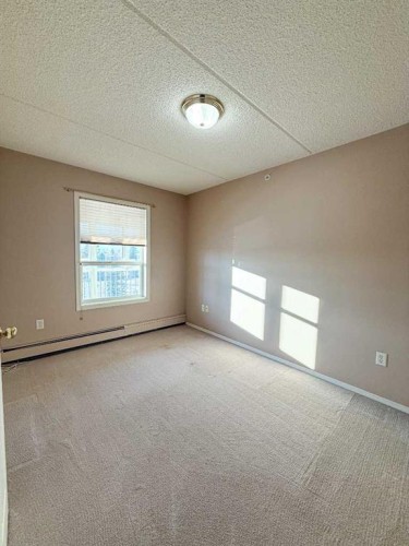 306-4514 54 Avenue, Olds, AB - Indoor Photo Showing Other Room