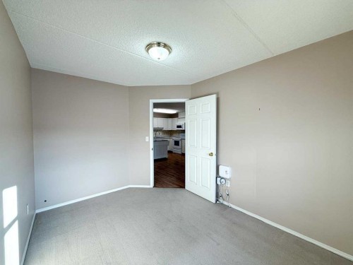 306-4514 54 Avenue, Olds, AB - Indoor Photo Showing Other Room