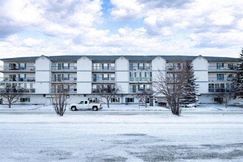 306-4514 54 Avenue, Olds, AB - Outdoor With Balcony With Facade