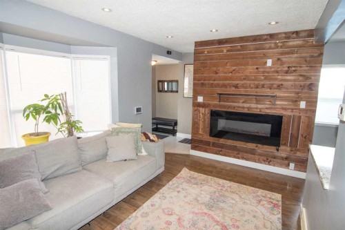 129 30 Avenue Nw, Calgary, AB - Indoor Photo Showing Living Room With Fireplace