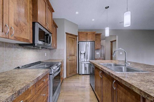 244 Eversyde Mews Sw, Calgary, AB - Indoor Photo Showing Kitchen With Double Sink With Upgraded Kitchen