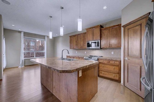 244 Eversyde Mews Sw, Calgary, AB - Indoor Photo Showing Kitchen With Double Sink