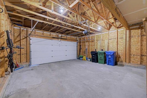 244 Eversyde Mews Sw, Calgary, AB - Indoor Photo Showing Garage
