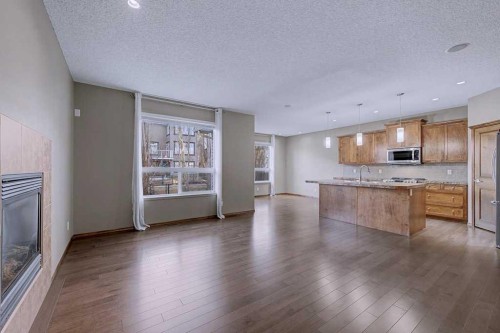 244 Eversyde Mews Sw, Calgary, AB - Indoor With Fireplace
