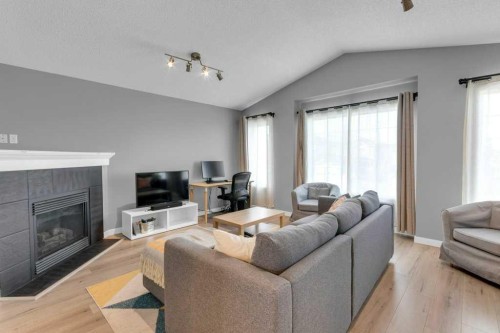 11185 Hidden Valley Drive Nw, Calgary, AB - Indoor Photo Showing Living Room With Fireplace