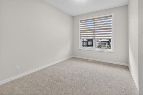 203-400 Belmont Street Sw, Calgary, AB - Indoor Photo Showing Other Room