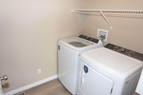24 Panamount Lane Nw, Calgary, AB - Indoor Photo Showing Laundry Room