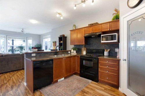 404-703 Luxstone Square Sw, Airdrie, AB - Indoor Photo Showing Kitchen With Double Sink