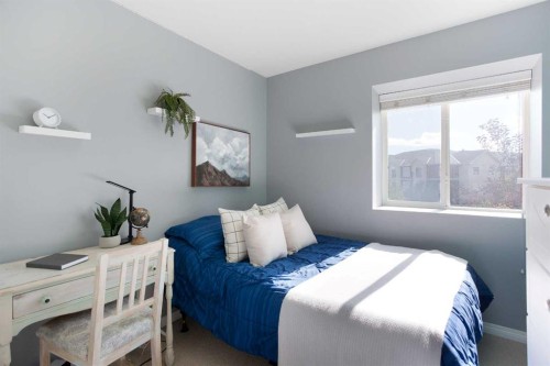 404-703 Luxstone Square Sw, Airdrie, AB - Indoor Photo Showing Bedroom