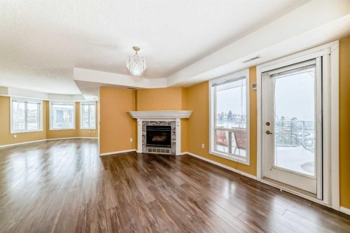 1322-1818 Simcoe Boulevard Sw, Calgary, AB - Indoor Photo Showing Living Room With Fireplace