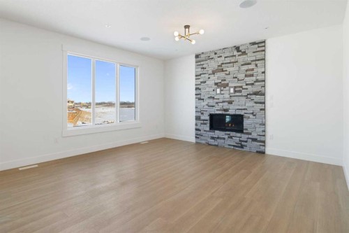 65 Lakes Estates Circle, Strathmore, AB - Indoor Photo Showing Living Room With Fireplace