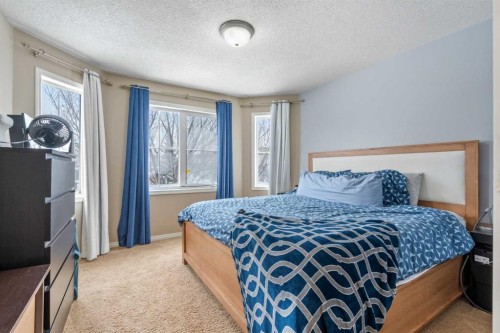 4 Tuscany Ridge Way Nw, Calgary, AB - Indoor Photo Showing Bedroom