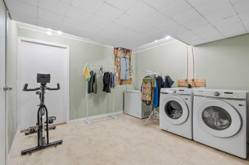4 Tuscany Ridge Way Nw, Calgary, AB - Indoor Photo Showing Laundry Room