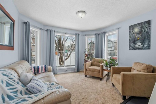 4 Tuscany Ridge Way Nw, Calgary, AB - Indoor Photo Showing Living Room