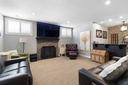800 E Lakeview Road, Chestermere, AB - Indoor Photo Showing Living Room With Fireplace