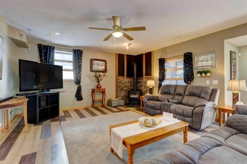 533 Highwood Drive, Longview, AB - Indoor Photo Showing Living Room With Fireplace