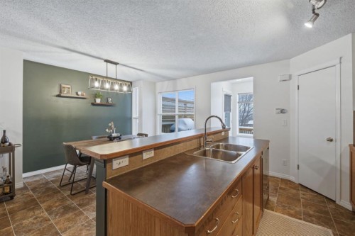 59 Prestwick Bay Se, Calgary, AB - Indoor Photo Showing Kitchen With Double Sink