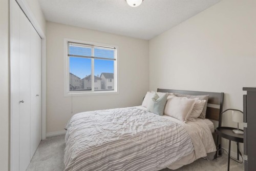 59 Prestwick Bay Se, Calgary, AB - Indoor Photo Showing Bedroom