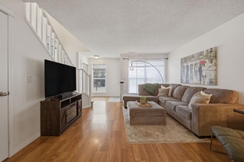 59 Prestwick Bay Se, Calgary, AB - Indoor Photo Showing Living Room
