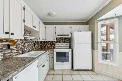 3412 Temple Road Ne, Calgary, AB - Indoor Photo Showing Kitchen With Double Sink