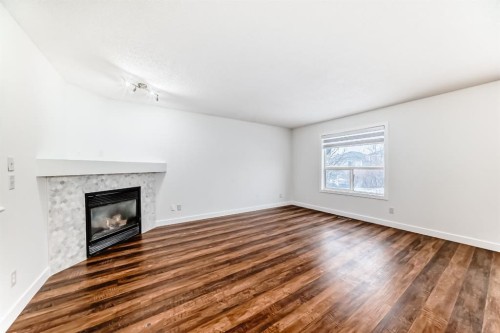 87 Bridlepost Green Sw, Calgary, AB - Indoor With Fireplace