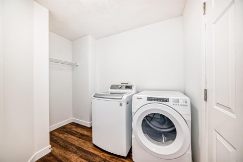 87 Bridlepost Green Sw, Calgary, AB - Indoor Photo Showing Laundry Room
