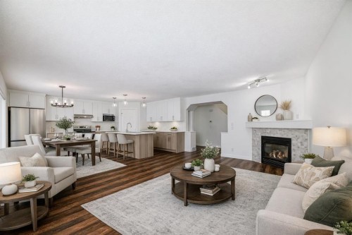 87 Bridlepost Green Sw, Calgary, AB - Indoor Photo Showing Living Room With Fireplace