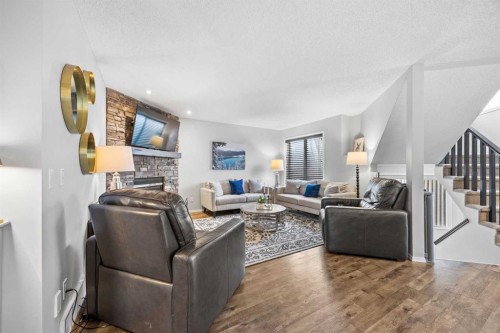 390 Cove Road, Chestermere, AB - Indoor Photo Showing Living Room With Fireplace