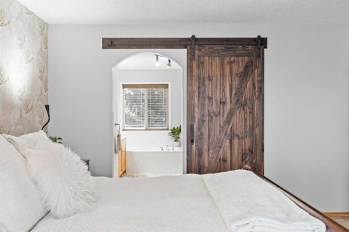 390 Cove Road, Chestermere, AB - Indoor Photo Showing Bedroom