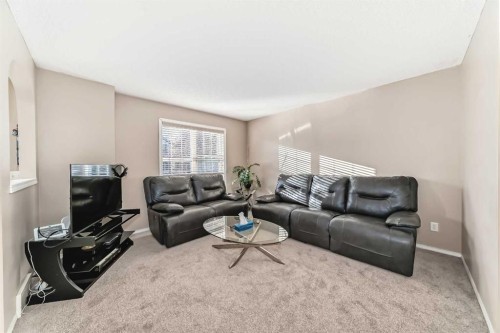 79 Saddlebrook Common Ne, Calgary, AB - Indoor Photo Showing Living Room