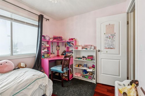 107 Sunbank Way Se, Calgary, AB - Indoor Photo Showing Bedroom