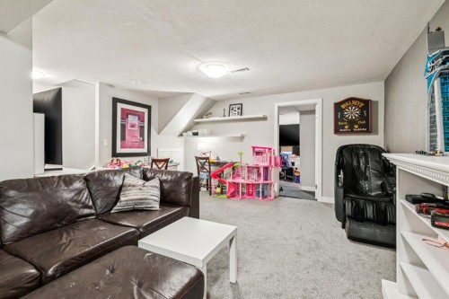 107 Sunbank Way Se, Calgary, AB - Indoor Photo Showing Living Room