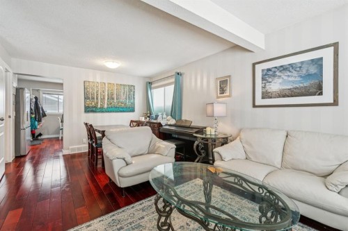 107 Sunbank Way Se, Calgary, AB - Indoor Photo Showing Living Room