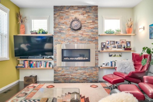 12 Sunrise View, Cochrane, AB - Indoor Photo Showing Living Room With Fireplace