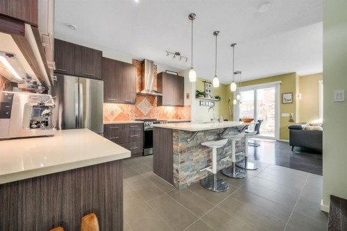 12 Sunrise View, Cochrane, AB - Indoor Photo Showing Kitchen With Upgraded Kitchen