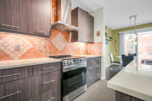 12 Sunrise View, Cochrane, AB - Indoor Photo Showing Kitchen With Upgraded Kitchen