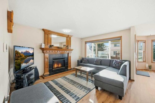 63 Coral Springs Green Ne, Calgary, AB - Indoor Photo Showing Living Room With Fireplace