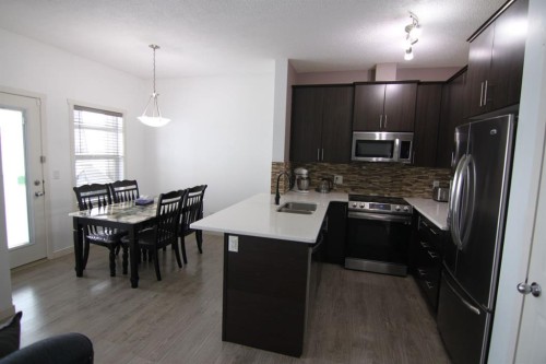 337 Copperpond Landing Se, Calgary, AB - Indoor Photo Showing Kitchen With Double Sink With Upgraded Kitchen